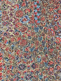8150: closeup 1980s Japanese chiriment silk, yosegire floral patterned fabric with dense small motifs in red, blue, beige, and brown tones.