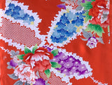 8070- closeup Colorful floral and geometric pattern on a vermillion red background
