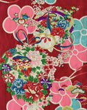 8129:  cloeup3 flowers, cords, drum 1930s Japan Ceremonial GIrls kimono deadstock silk fabric:  of a Japanese-style floral fabric pattern on a deep red background, featuring large pink and turquoise flowers with smaller multicolored blossoms and green leaves