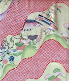 81312:close-up3 of a Japanese-style patterned fabric featuring wavy bands, streams, river boat, floral motifs, birds, and small traditional house details in pink, green, purple, blue, and cream.