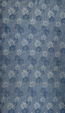 81392:1960s Rinzu Kimono Silk, A  middle close-up of a blue patterned fabric with a repeating chrysanthemums motif in lighter and darker blue tones.
