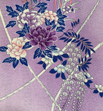 8152; jSilk  close-up of a lavender purple fabric featuring an elegant Japanese-style floral print with peonies in shades of purple and pink, wisteria, and dark blue leaves, accented by cream-colored rope-like lines.