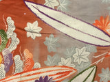 7967-Close-up 2 of a floral pattern with leaves and flowers on a textured fabric background. tiny holes