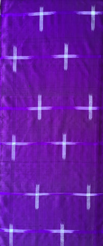 Purple fabric with white cross patterns