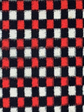 8005 closeup Checkered fabric pattern with red, white, and black squares