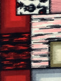 81072: 1930s Meisen silk, closeup Abstract textile or fabric close-up with vertical striped panels in pink, white, black, and gray, plus a red lower section and a small beige block near the top right.