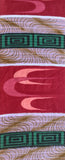 8132: 1950s Cotton Meisen full 56 inches view of a patterned textile featuring a burgundy-red base with pink abstract wave motifs, white bands, and green geometric medallion accents with gold wavy lines.