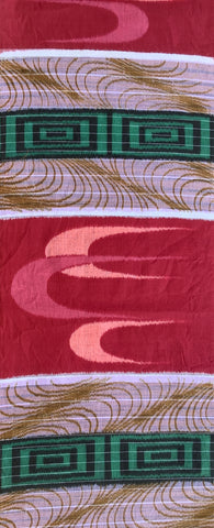8132: 1950s Cotton Meisen full 56 inches view of a patterned textile featuring a burgundy-red base with pink abstract wave motifs, white bands, and green geometric medallion accents with gold wavy lines.