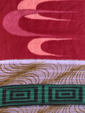 8132: second close-up of a patterned textile with a deep red upper section, swallows in flight, a white band with gold curved lines (waves,water), and a green geometric border at the bottom.