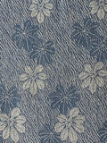 8139:1960s Rinzu Kimono Silk, A  close-up of a blue patterned fabric with a repeating chrysanthemums streaking Shigure
